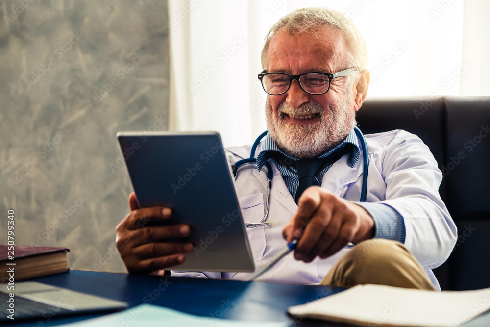 Doctor working in hospital office.