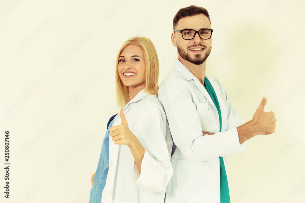 Portrait of confident doctors on white background.