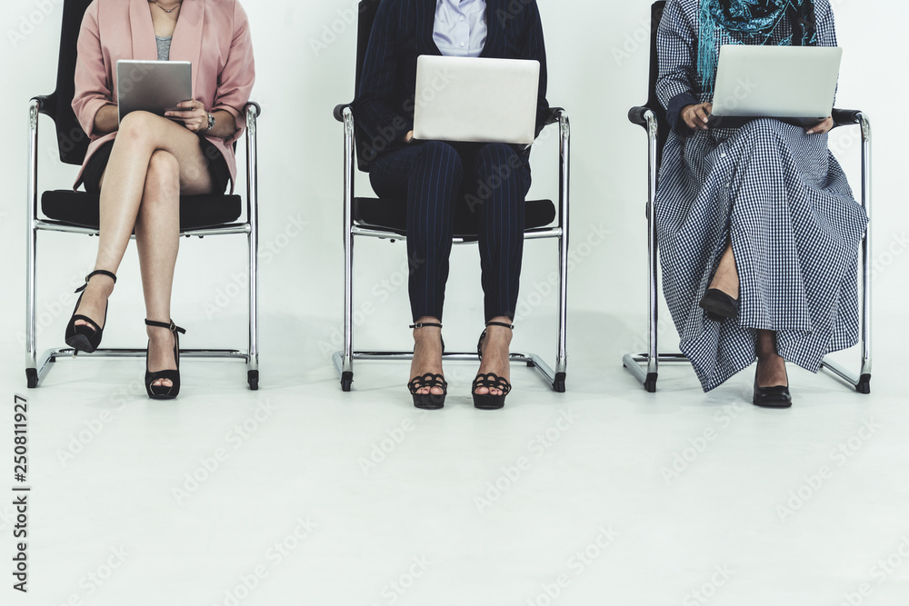 Business people job applicants waiting on chairs.