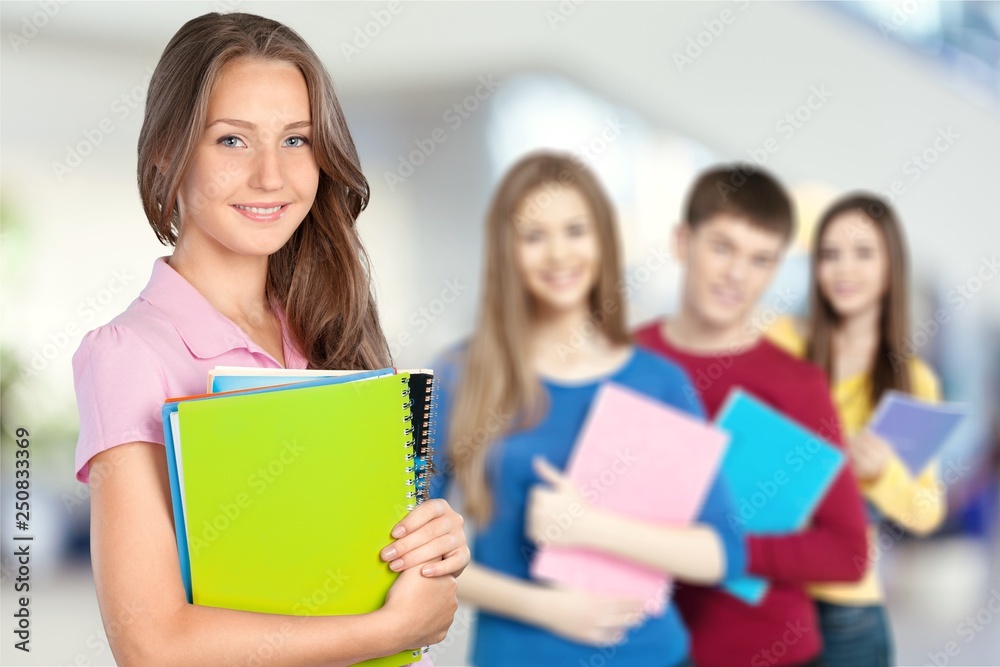 Young female student with people on background