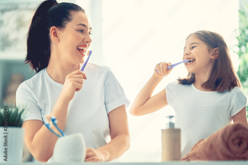 family are brushing teeth