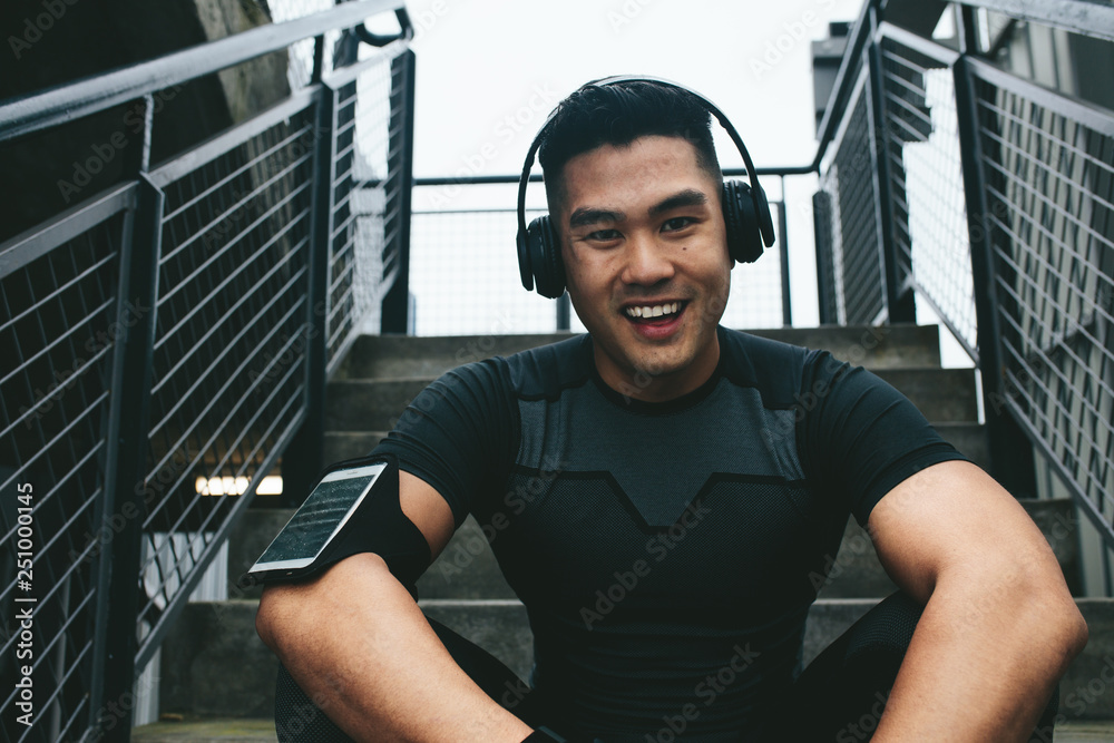 Asian man taking break after training session