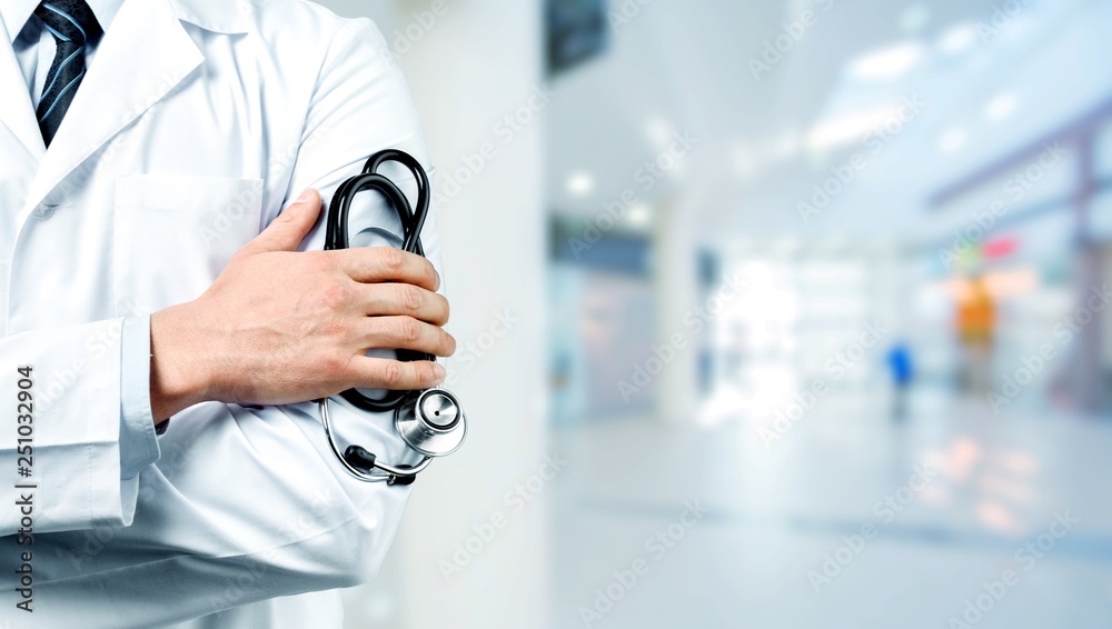 Young man doctor holding stethoscope