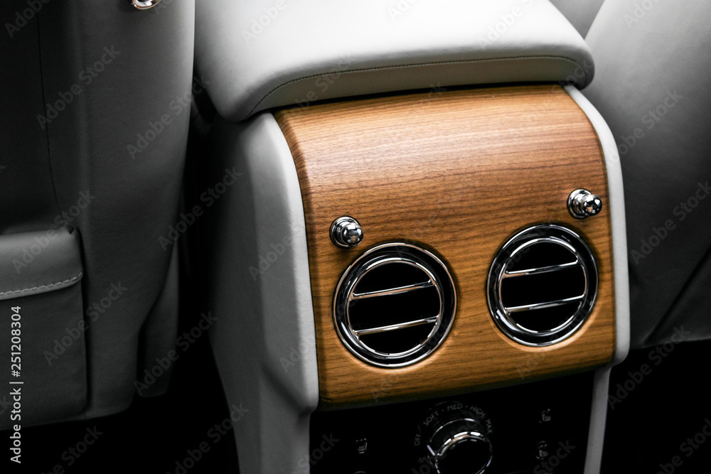 AC Ventilation Deck in Luxury modern car Interior. Modern car white leather interior. with stitchig.