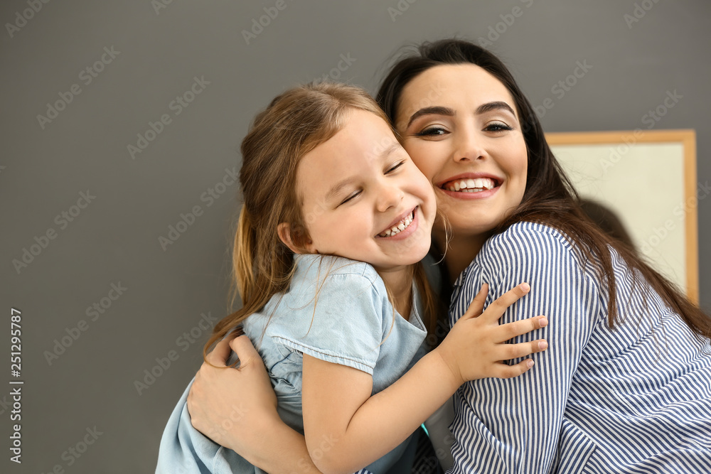 Portrait of cute little girl with mother