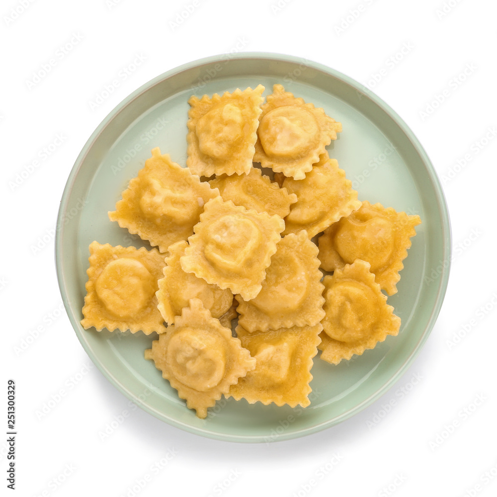 Plate with tasty ravioli on white background