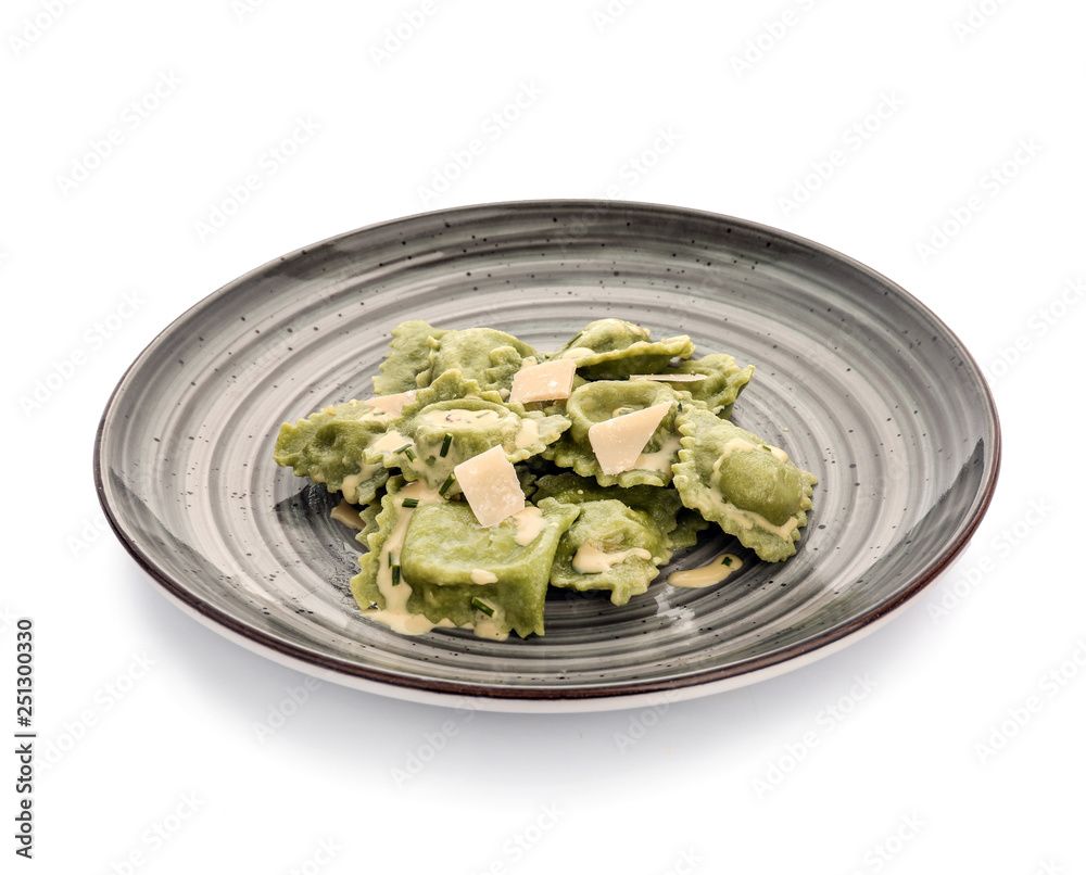 Plate with tasty ravioli on white background