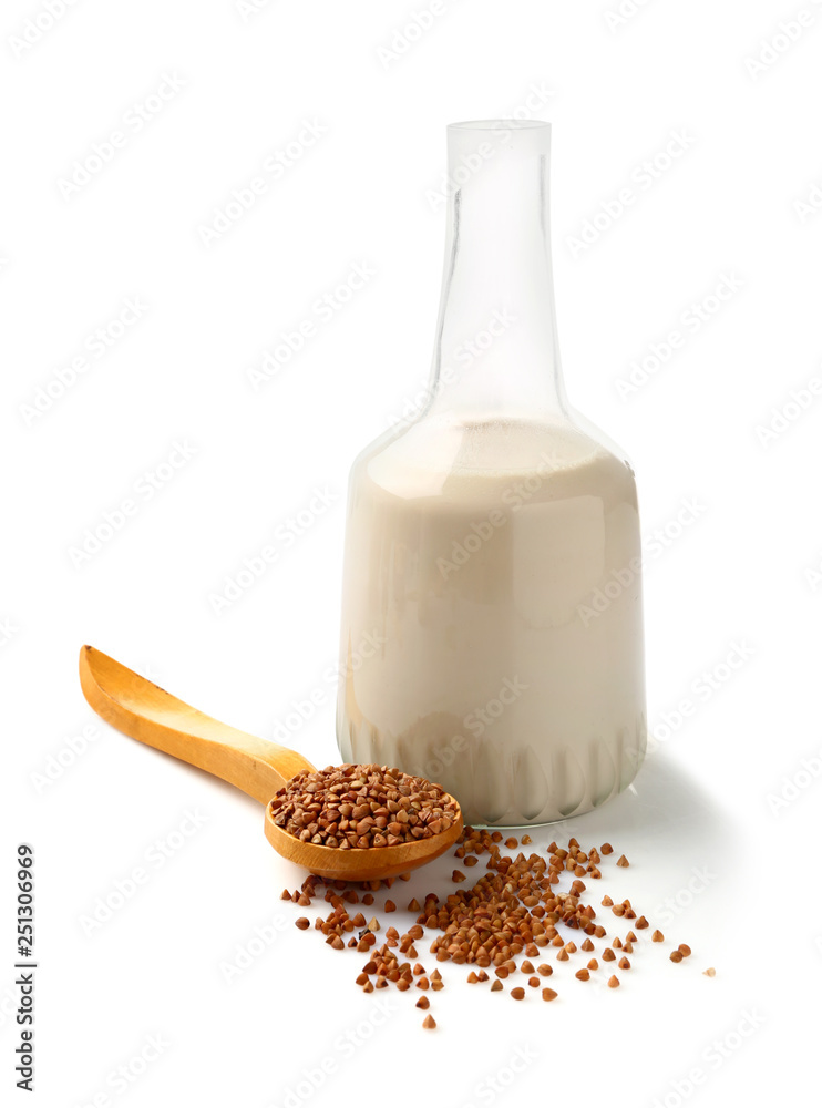 Bottle of tasty buckwheat milk on white background