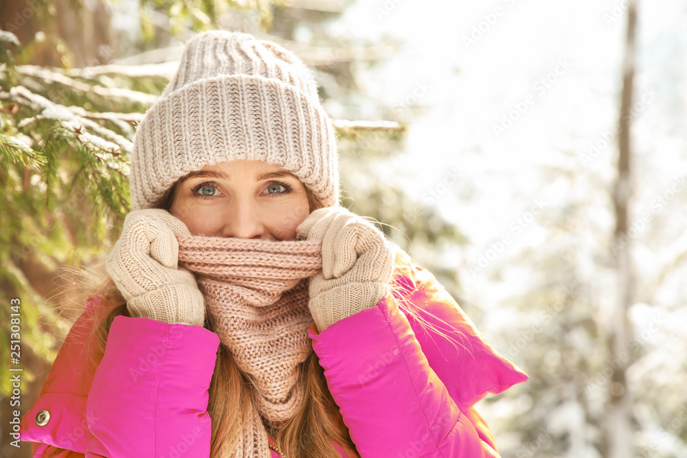 Beautiful woman in winter forest