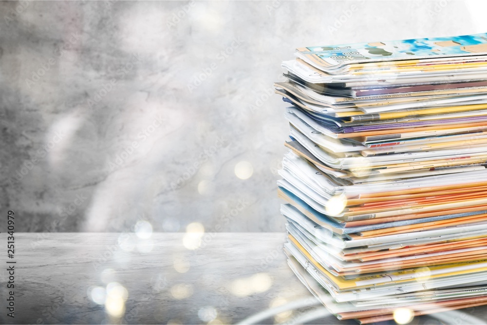 Pile of newspapers on white background