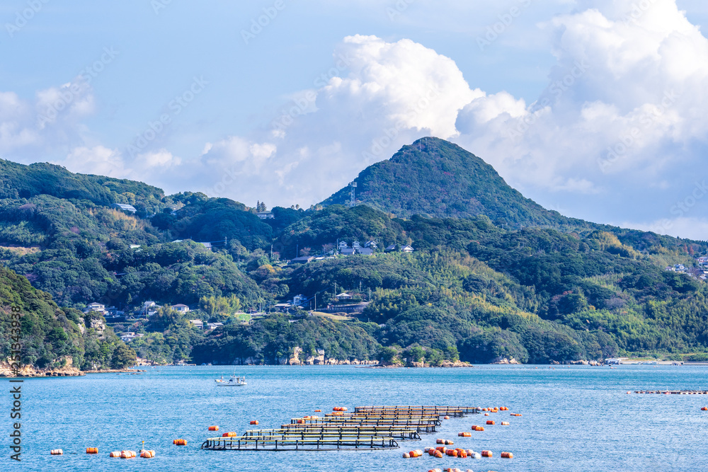 Many small islands over the blue ocean in sunny day, famous Kujukushima(99 islands) pearl sea resort