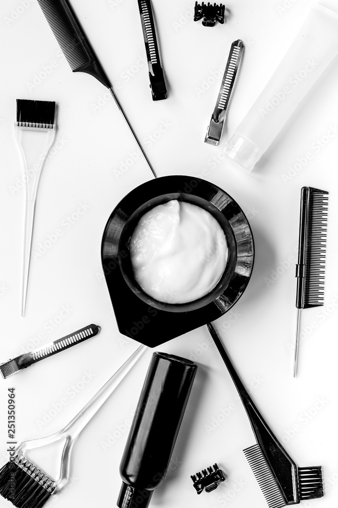 Tools for hair dye in barbershop on white background top view