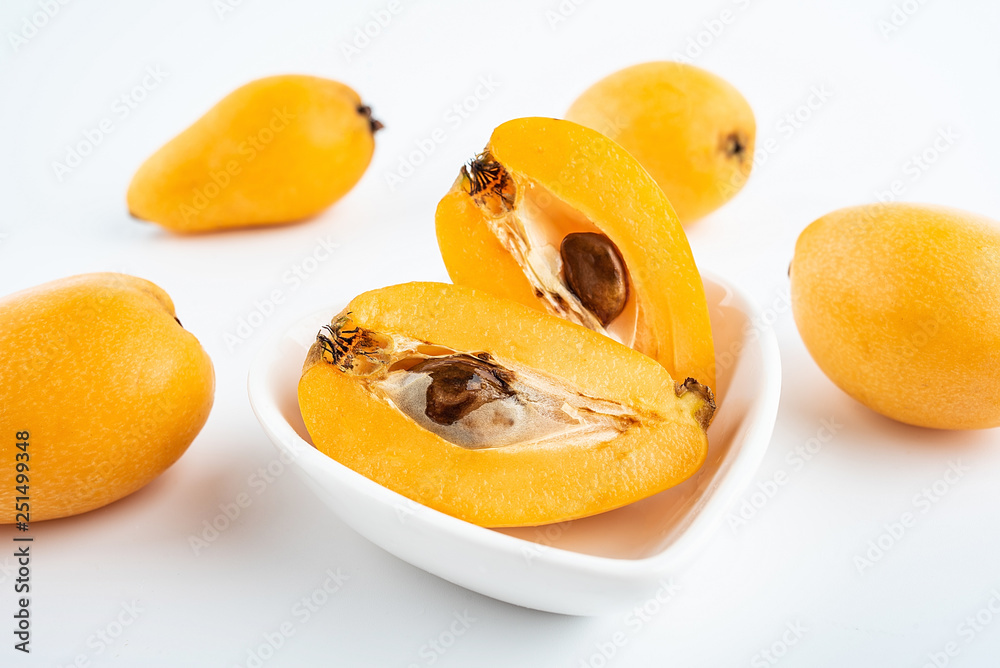 Cut hazelnuts on white background