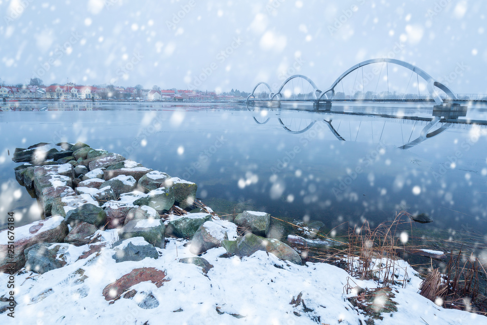 Solvesborgsbron pedestrian bridge with falling snow in the south of Sweden