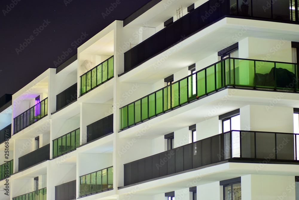 Exterior of apartment building at night 