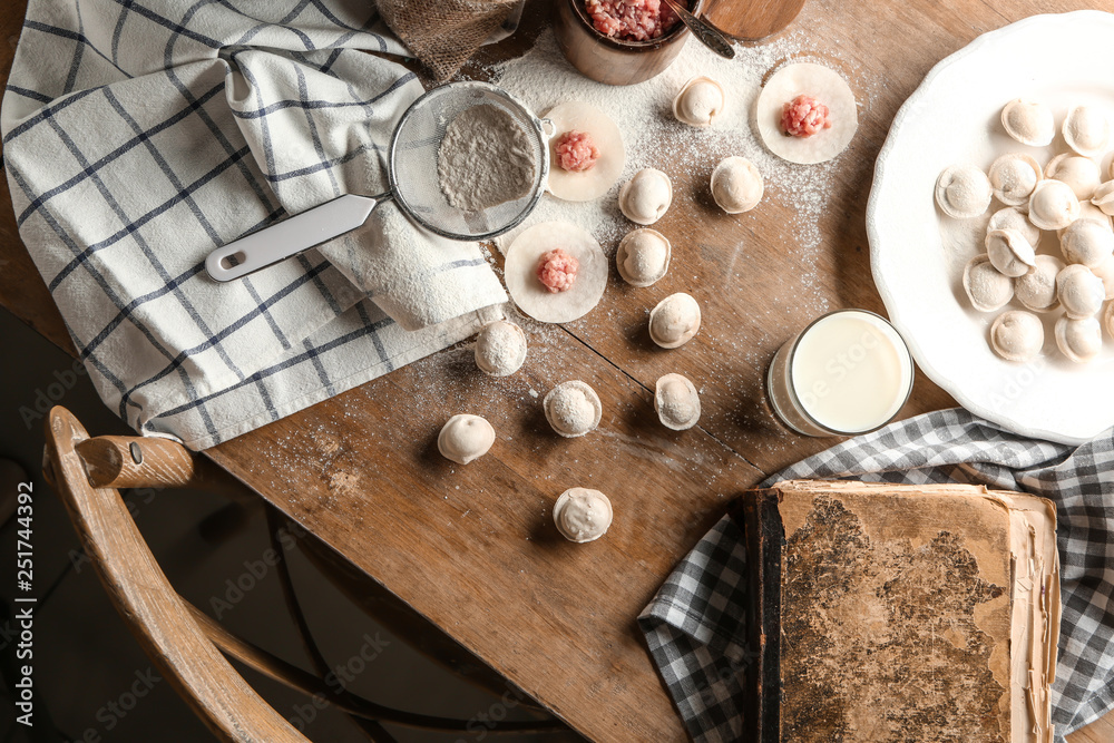 Composition with raw dumplings on table