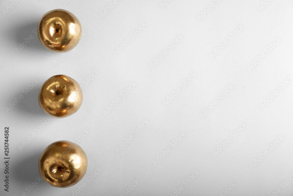 Golden apples on white background