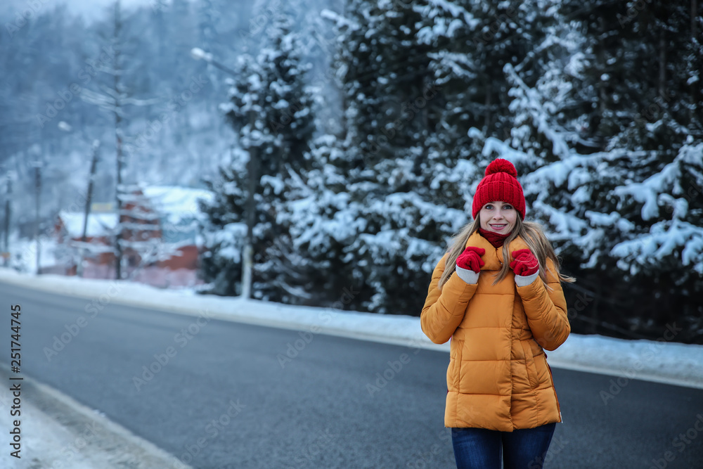 Beautiful woman in countryside on winter day