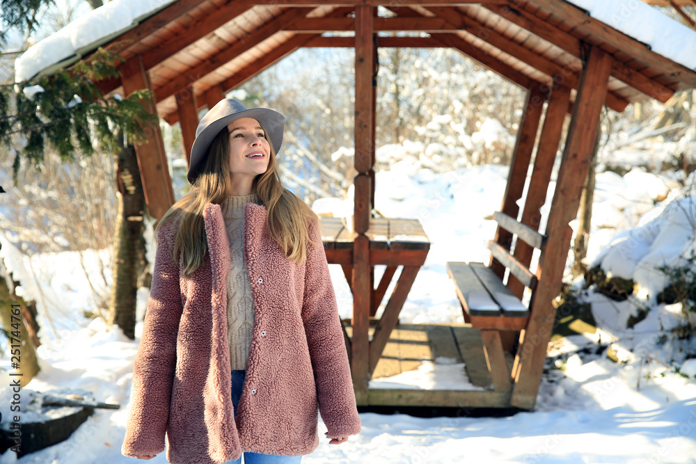 Beautiful woman at snowy resort