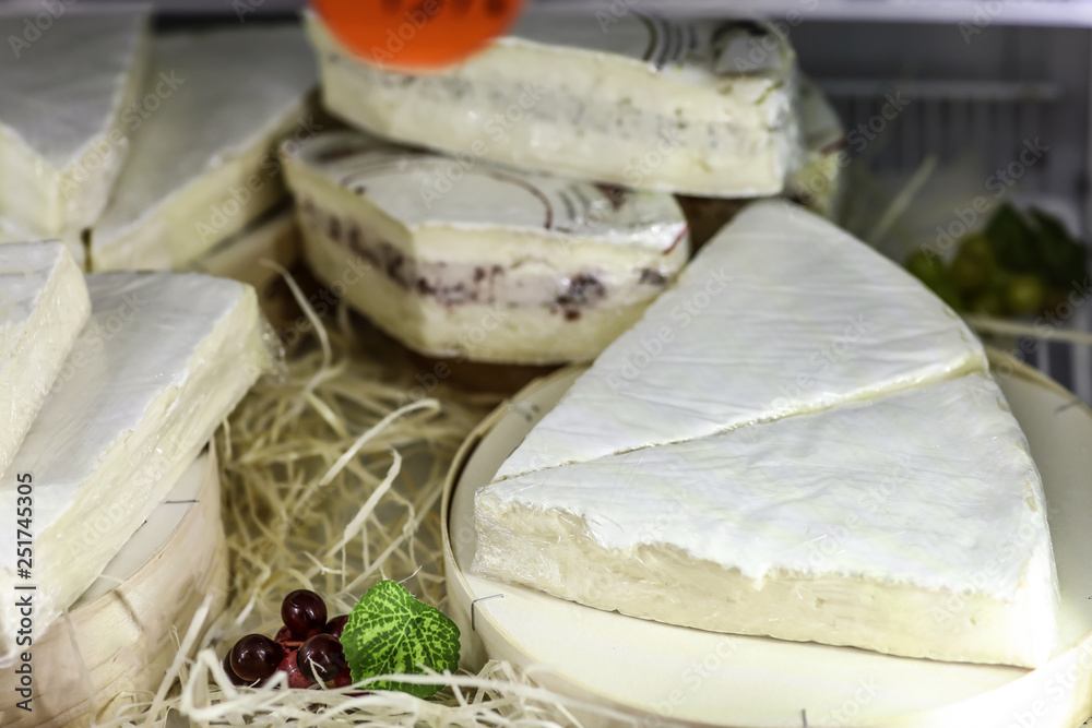 Tasty cheese on counter in store