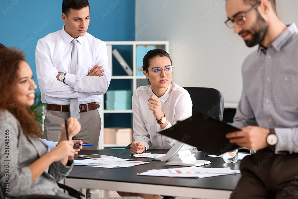 Young people having business meeting in office