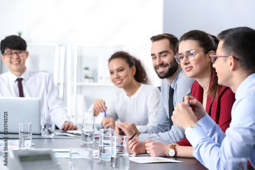 Young people having business meeting in office