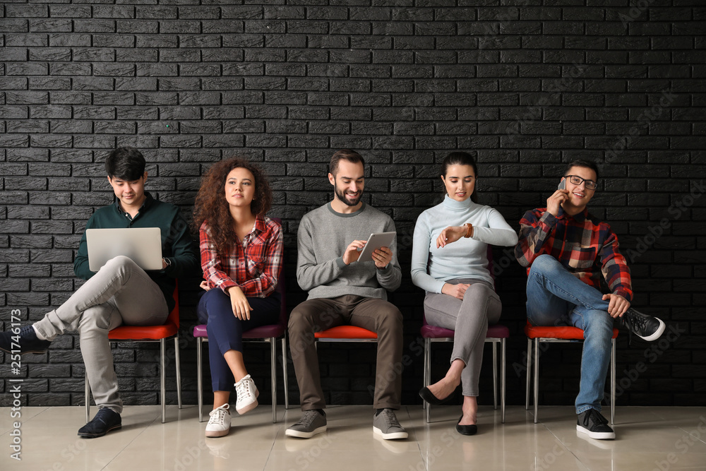 Young people waiting for job interview indoors