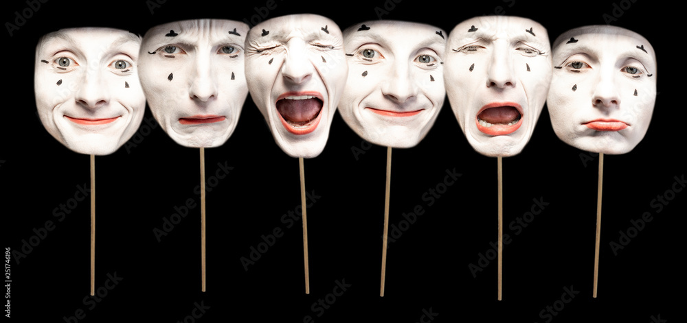 Masks with different emotions of pantomime on the black background