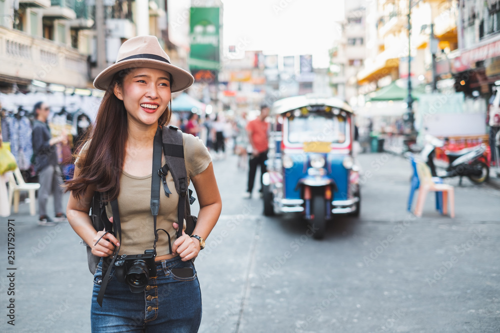 Asian woman tourist backpacker travel in Khao San road, Bangkok, Thailand