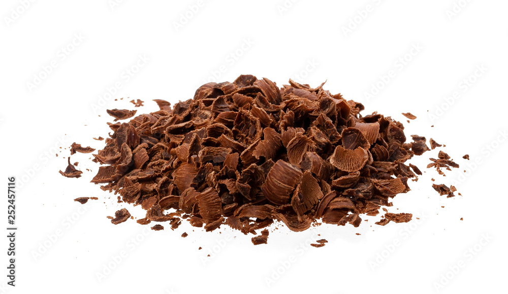 Grated chocolate. Heap of ground chocolate isolated on white background, closeup