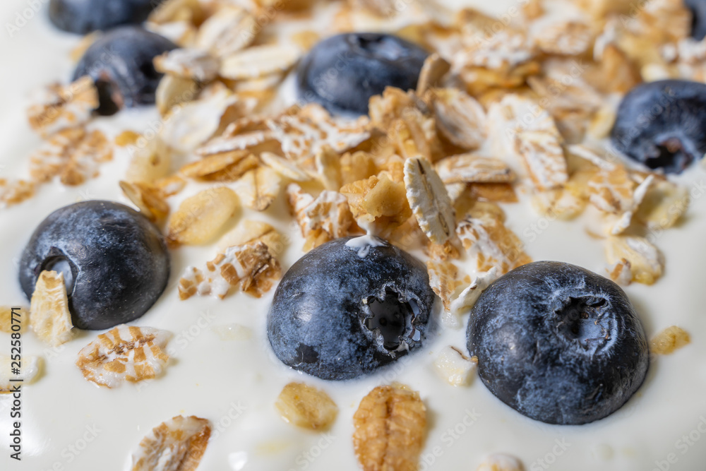 Healthy breakfast. Yogurt with granola and blueberry