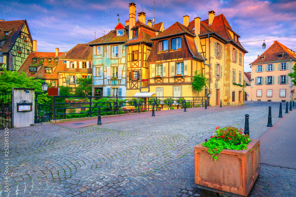 Paved street and medieval half timbered facades in Colmar, France