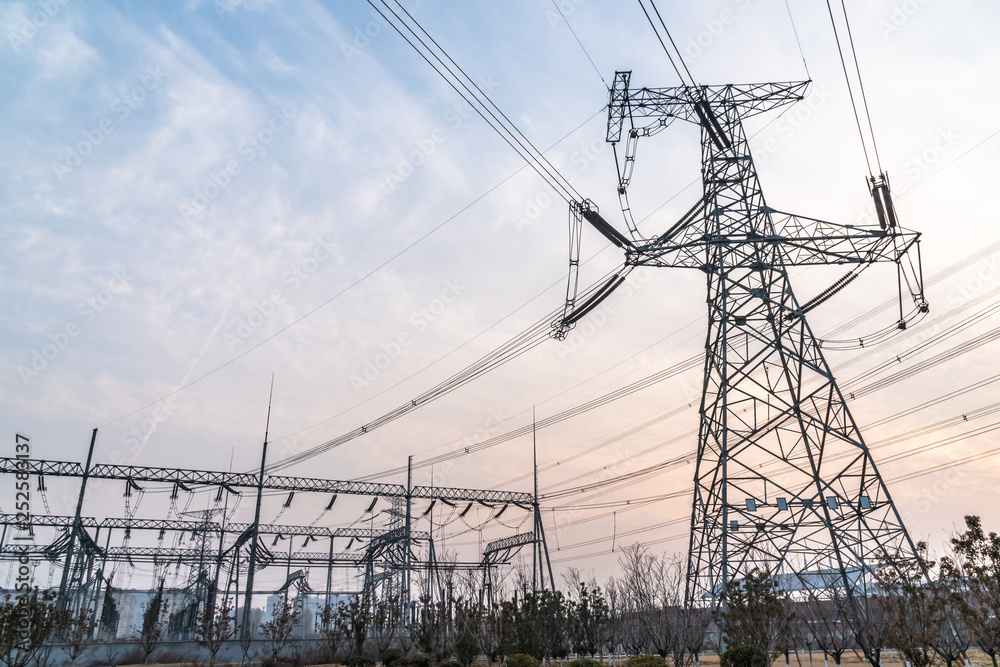 electricity pylons at sunset