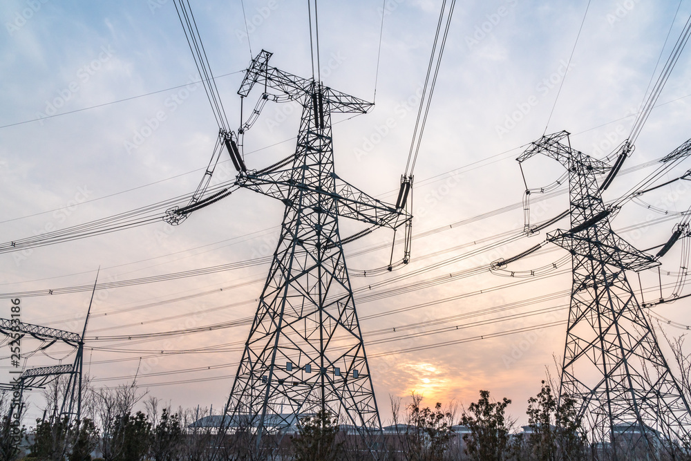 electricity pylons at sunset