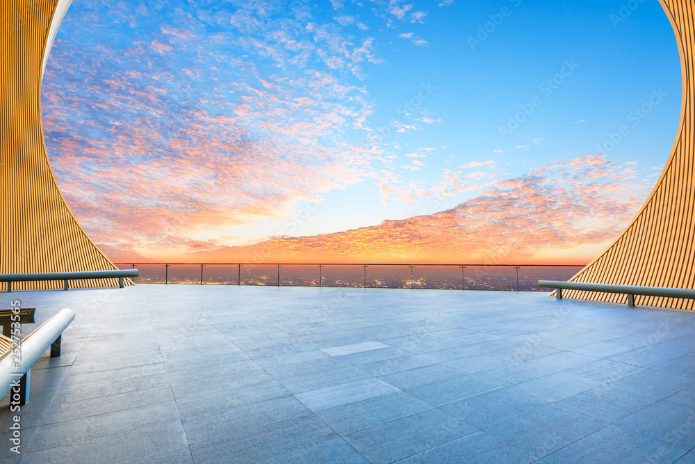 Empty square floor and modern city skyline with beautiful colorful clouds at sunset