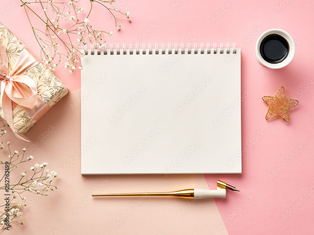 Mock up of blank envelopes on pink or beige background with calligraphy pen, ink, flowers and presen