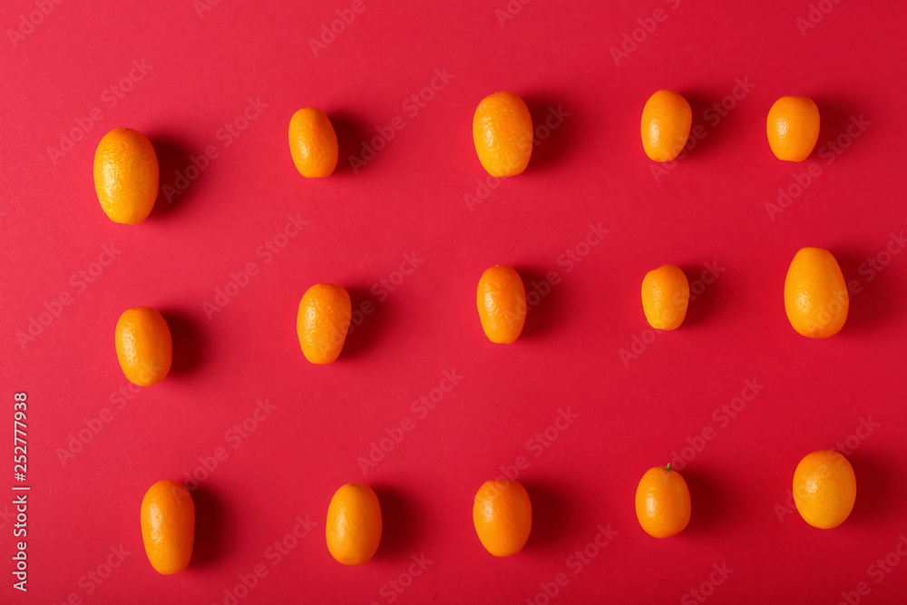 Delicious kumquat fruit on color background