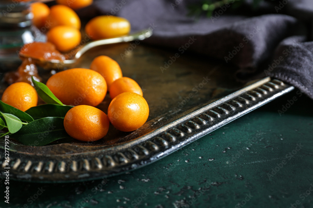 Delicious kumquat fruit on metal tray