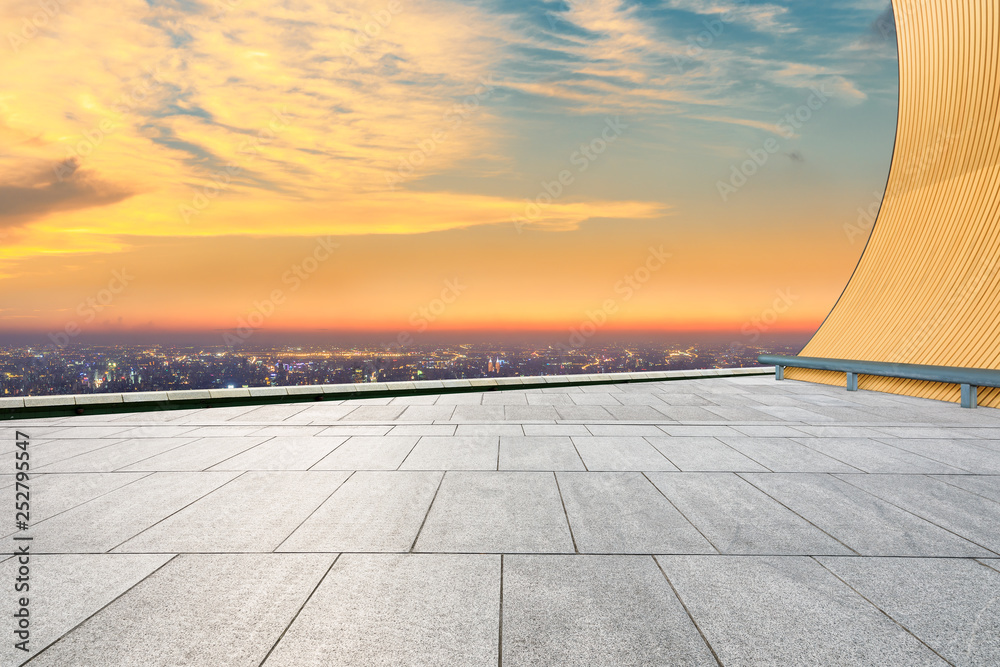 Empty square floor and modern city skyline with beautiful colorful clouds at sunset