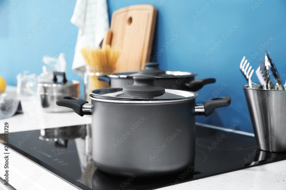 Saucepan on stove in kitchen