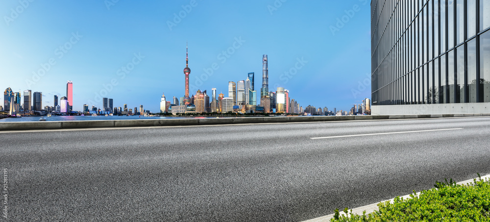 Empty asphalt road through Shanghai business district