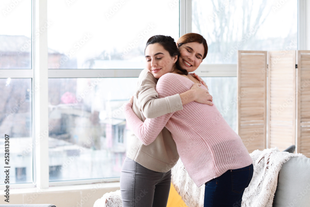 Happy pregnant woman with doula at home