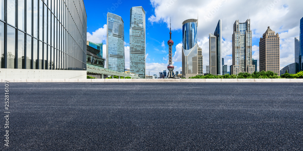 Asphalt road passes through Shanghai Lujiazui Financial District