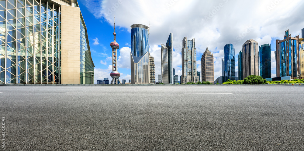 Asphalt road passes through Shanghai Lujiazui Financial District