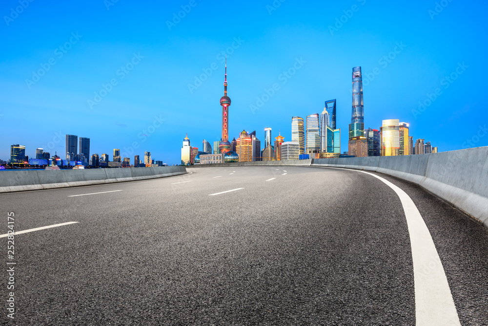 Empty asphalt road through Shanghai business district