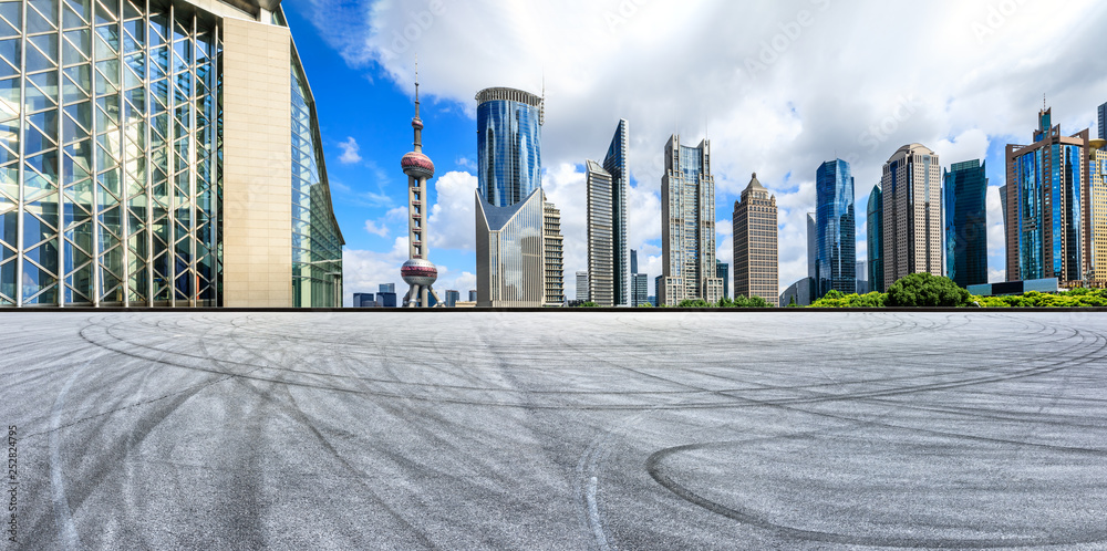 Empty asphalt square ground with panoramic city skyline in Shanghai,China