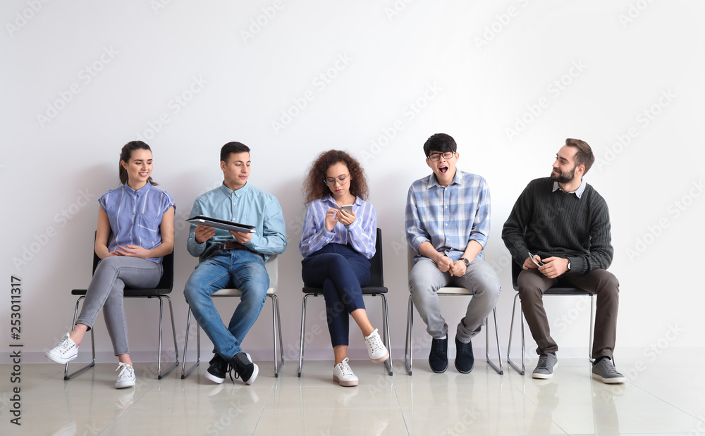 Young people waiting for job interview indoors