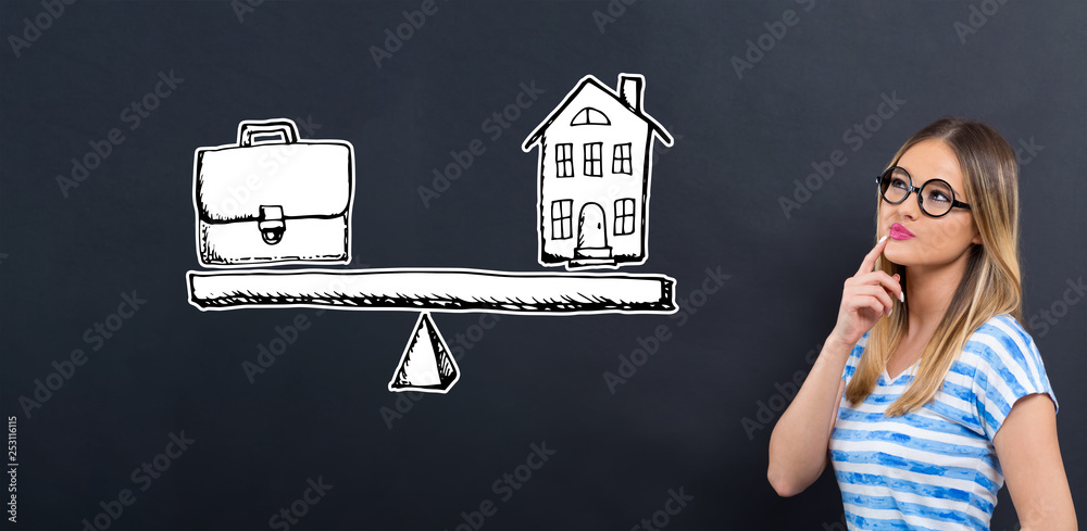 Work and life balance with young woman in front of a blackboard