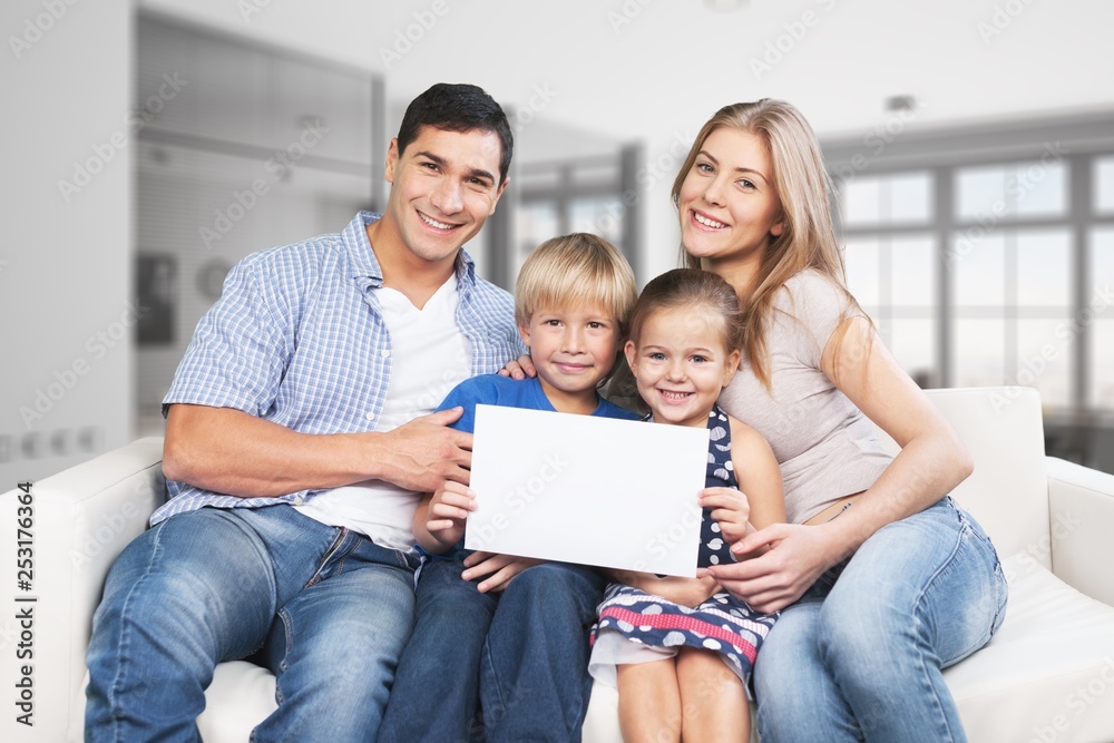 Beautiful smiling family in room at home