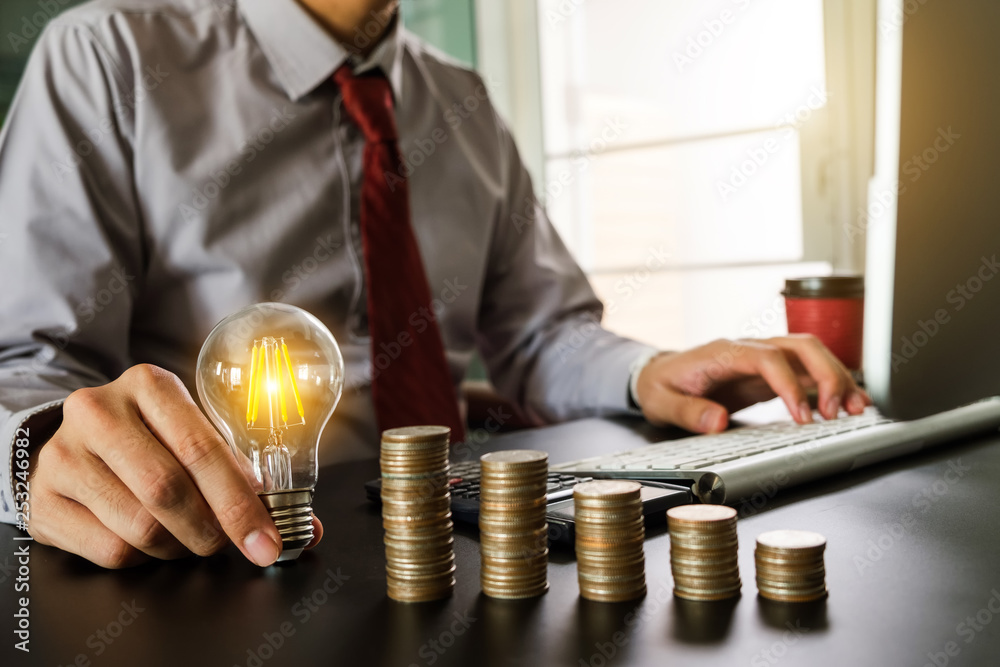 business hand showing creative business strategy with light bulb as concept